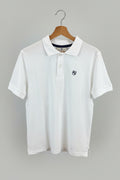 Polo American College blanc Logo AC