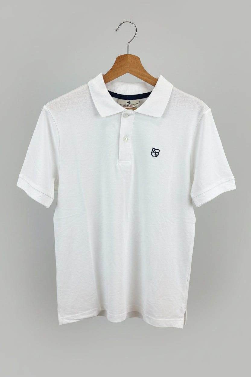 Polo American College blanc Logo AC